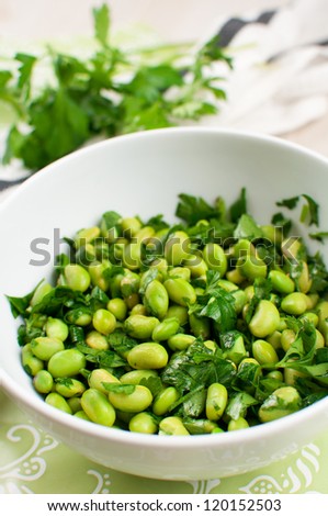 Green salad with edamame and parsley vertical
