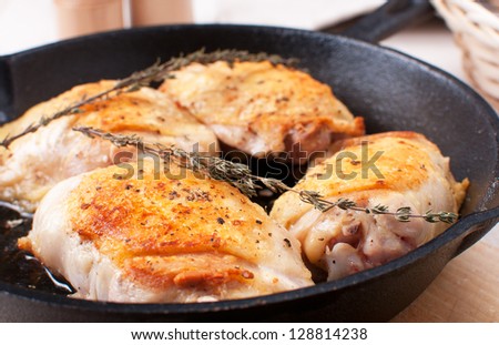 Golden crisp chicken thighs with herbs and spices horizontal