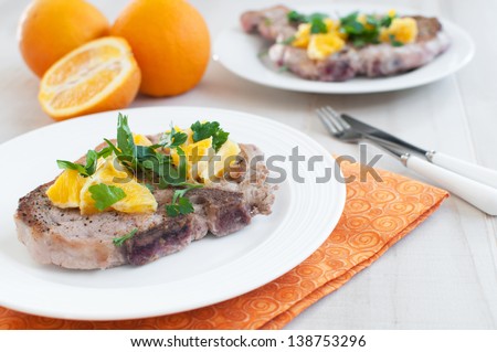 Pork chops with orange salsa sauce