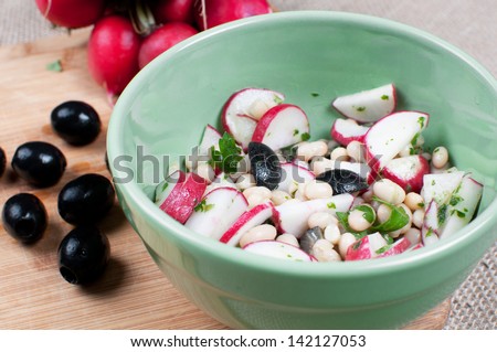 Salad with radishes and black olives horizontal