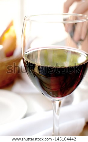 Outside dining in restaurant with red wine