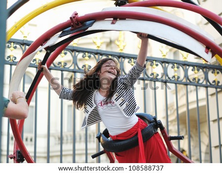 BRUSSELS, BELGIUM - JULY, 21: Unidentified brave tourist takes Aerotrim test during National Day of Belgium celebrations on July 21, 2012 in Brussels.