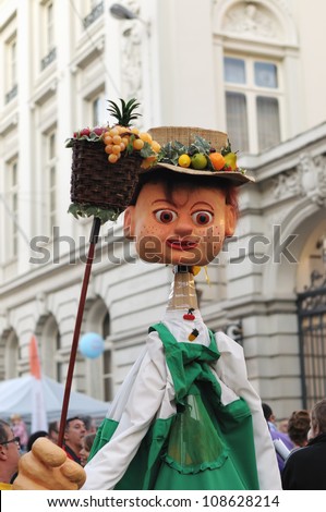 BRUSSELS, BELGIUM - JULY, 21: Unidentified actor shows giant character costume during National Day of Belgium celebrations on July 21, 2012 in Brussels, Belgium.