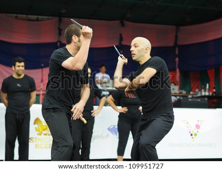 BRUSSELS, BELGIUM-JUNE 10: Two unidentified performers show martial arts fight during Asia & U festival on June 10, 2012 in Brussels. This is annual festival of Asian cultures in Belgium.