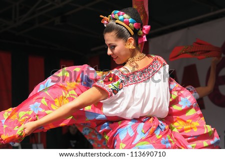 BRUSSELS BELGIUM-SEPTEMBER 15 Dancer of Xochicalli Mexican folkloric ballet performs in a concert on Grand Place during 12 edition of Folklorissimo Festival on September 15 2012 in Brussels BRUSSELS BELGIUM-SEPTEMBER 15 Dancer of Xochicalli Mexican folkloric ballet performs in a concert on Grand Place during 12 edition of Folklorissimo Festival on September 15 2012 in Brussels