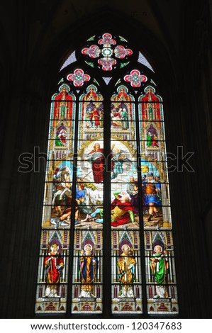 COLOGNE, GERMANY-APRIL 10: Bible stories presented in gothic style on stained glass window in Cologne Cathedral on April 10, 2010 in Cologne. The cathedral has about 20000 visitors per day