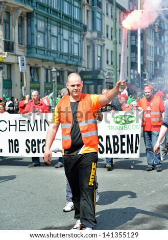 BRUSSELS, BELGIUM-JUNE 6: Belgian people participate in demonstration against austerity measures and requesting an equal status for employees and workers on June 6, 2013 in Brussels.