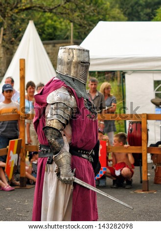 REMOUCHAMPS, BELGIUM-AUGUST 19: Unidentified performer shows medieval costume of a knight during Medieval Celebration on August 19, 2012 in Remouchamps.