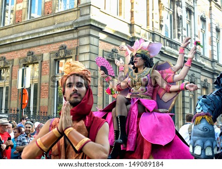 BRUSSELS, BELGIUM-JULY 21: Unidentified street actors play scene in defile during Belgian National Day activities on July 21, 2013 in Brussels.