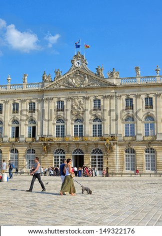 NANCY, FRANCE - JULY, 6: Tourists groups enter city hall on Place Stanislas in historical center of Nancy on July 6, 2013 in Nancy. This square is in World Heritage Sites list of UNESCO since 1983