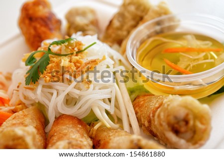 Chinese take away food rolls with different meat, vegetables and noodles