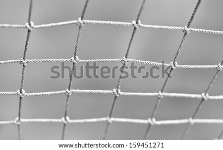 Fisherman net shallow DOF black and white image