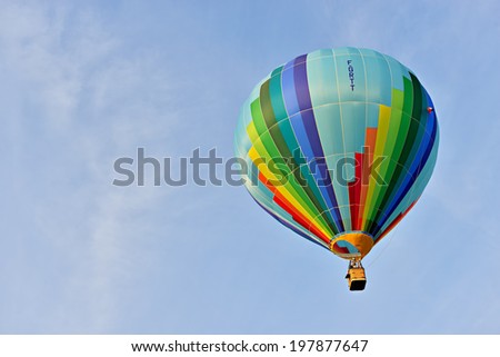 ROCHEFORT, BELGIUM-MAY 31, 2014: Hot air balloons in the sky of Walloon. Expensive sport is supported by different sponsors which place their logos on the balloons.
