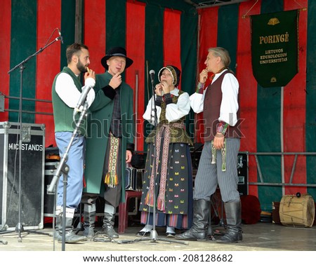 BRUSSELS, BELGIUM-SEPTEMBER 21, 2013: Lithuanian Folk music group Poringe gives free concert on Grand Place after ceremony of award of costume to Manneken Pis.