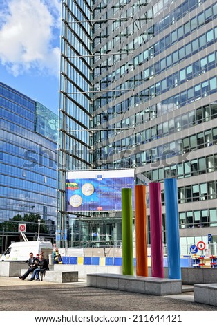 BRUSSELS, BELGIUM-AUGUST 18, 2014: Modern office of European Commission in European Quarter of Brussels and entry to metro Shuman.