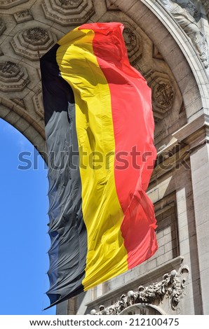 Belgian flag waving in Triumphal Arch in Cinquantenaire Park in Brussels, Belgium.Slight tone effect applied