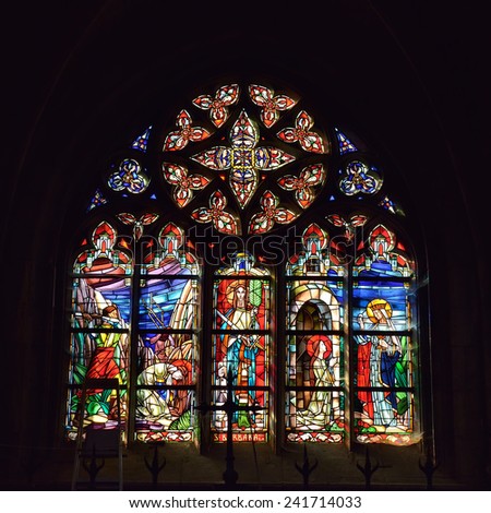 WALCOURT, BELGIUM-SEPTEMBER 28, 2014: Cathedral window in basilica Saint-Materne with image of Saint Barbara. Basilica was built in 11 century and it is a home of statue of Black Madonna of Walcourt