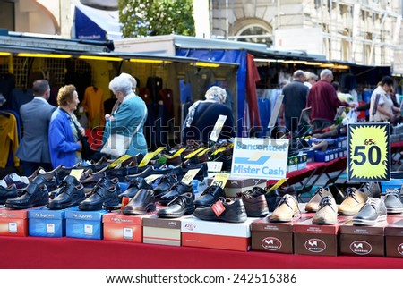 LEUVEN, BELGIUM-SEPTEMBER 12, 2014: Thanks to modern technologies the buyers on street market can pay using their credit cards and not only by cash