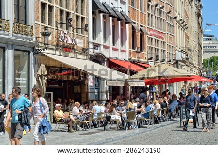 BRUSSELS, BELGIUM-JUNE 06, 2015: Tourists crowded streets and cafes in historical center of Brussels