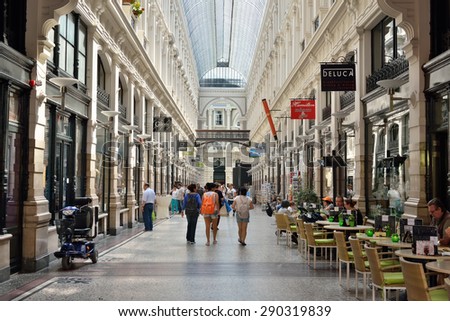 HAGUE, NETHERLANDS-AUGUST 01, 2014: Tourists crowded gallery with shops in the center of Hague.