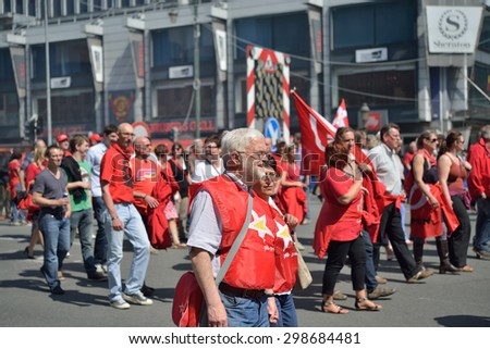BRUSSELS, BELGIUM-JUNE 6, 2013: Belgian people participate in demonstration against austerity measures and requesting an equal status for employees and workers in Brussels.