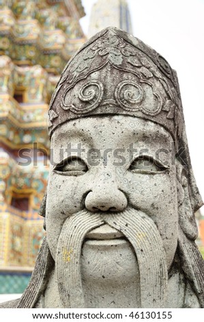 Ancient statue of warrior in buddhist temple in Bangkok, Thailand
