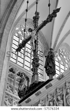 black and white image of cross in cathedral of Leuven