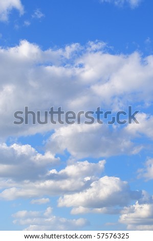 blue sky with white clouds of different shapes in perspective