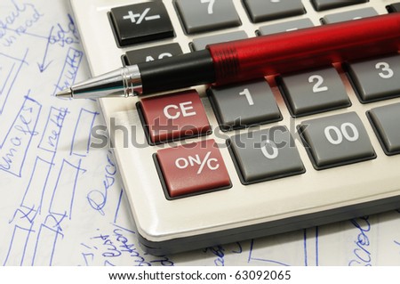 Ball pen, calculator and text written especially for this photo, closeup image