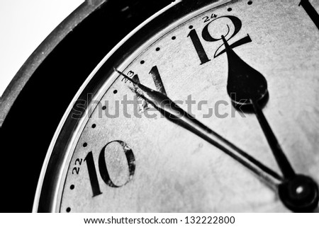 Close up of a retro clock time five to twelve o\'clock, concept of time