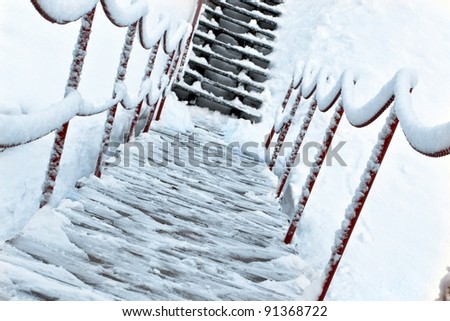 Wooden bridge and up stairs in snow
