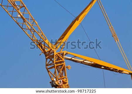 crane hydraulic arm over blue sky background