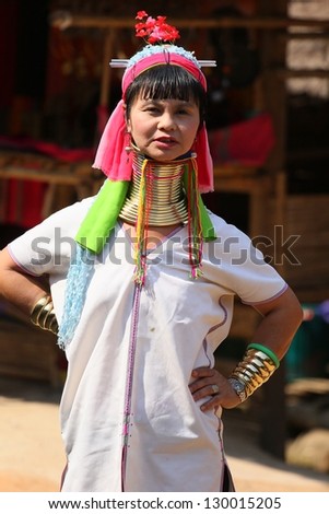 CHIANG RAI, THAILAND - FEB 26 : Karen long neck hill tribe with traditional clothes and silver jewelery in  hill tribe minority village on February 26, 2013 in Chiang Rai, Thailand.