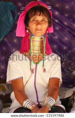 CHIANG RAI, THAILAND - FEB 26 : Karen long neck hill woman with traditional clothes and silver jewelery in hill tribe minority village on February 26, 2013 in Chiang Rai, Thailand