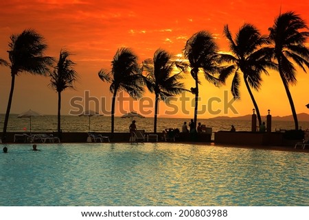 orange sky when sunset in the horizon with the swimming pool orange sky when sunset in the horizon with the swimming pool