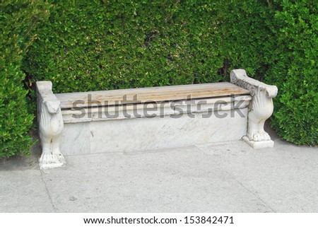 An ancient stone bench in the interior of the palace and park ensemble