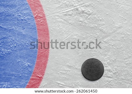 The puck lying on a hockey rink. Texture, background
