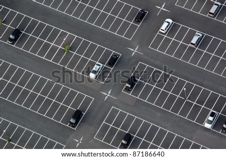 Car park seen from above with many empty parking lots