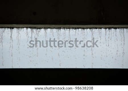 Curtain of water seen from inside a building