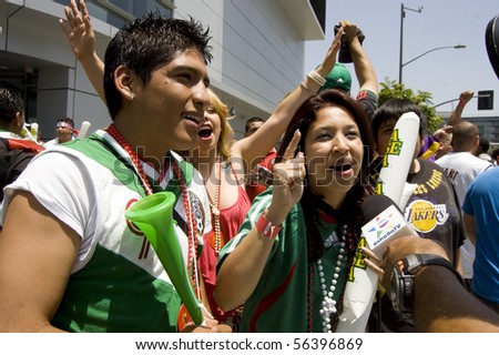 LOS ANGELES, CALIFORNIA-JUNE 17: Mexico supporters talk to cameras after World Cup win over France June 17, 2010 in Los Angeles, California