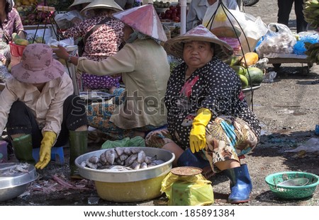 Ho Chi Minh City, Vietnam-November 2nd 2013: Women selling fish in Cholon market. Cholon is in District 5 and lies on the west bank of the Saigon river.