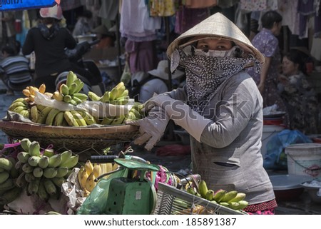 Ho Chi Minh City, Vietnam-November 2nd 2013: A woman selling bananas in Cholon market. Cholon is in District 5 and lies on the west bank of the Saigon river.