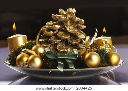 Christmas still life: burn candle, golden balls and festiv decoration object