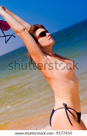stock photo leisure series young pretty nude woman on the beach