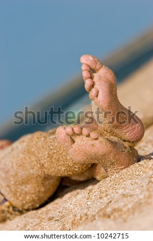 leisure seies: sandy foot on summer sea beach