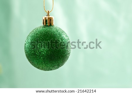 Holiday series: christmas green ball over light green background