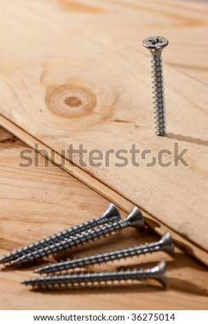 tools series: long nails on wooden table