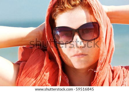 people series: summer woman portrait on sea with shawl