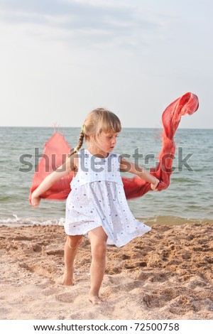 people series: little girl on sea beach are play the shawl game