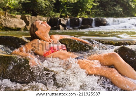 The girl in the waterfall spray
